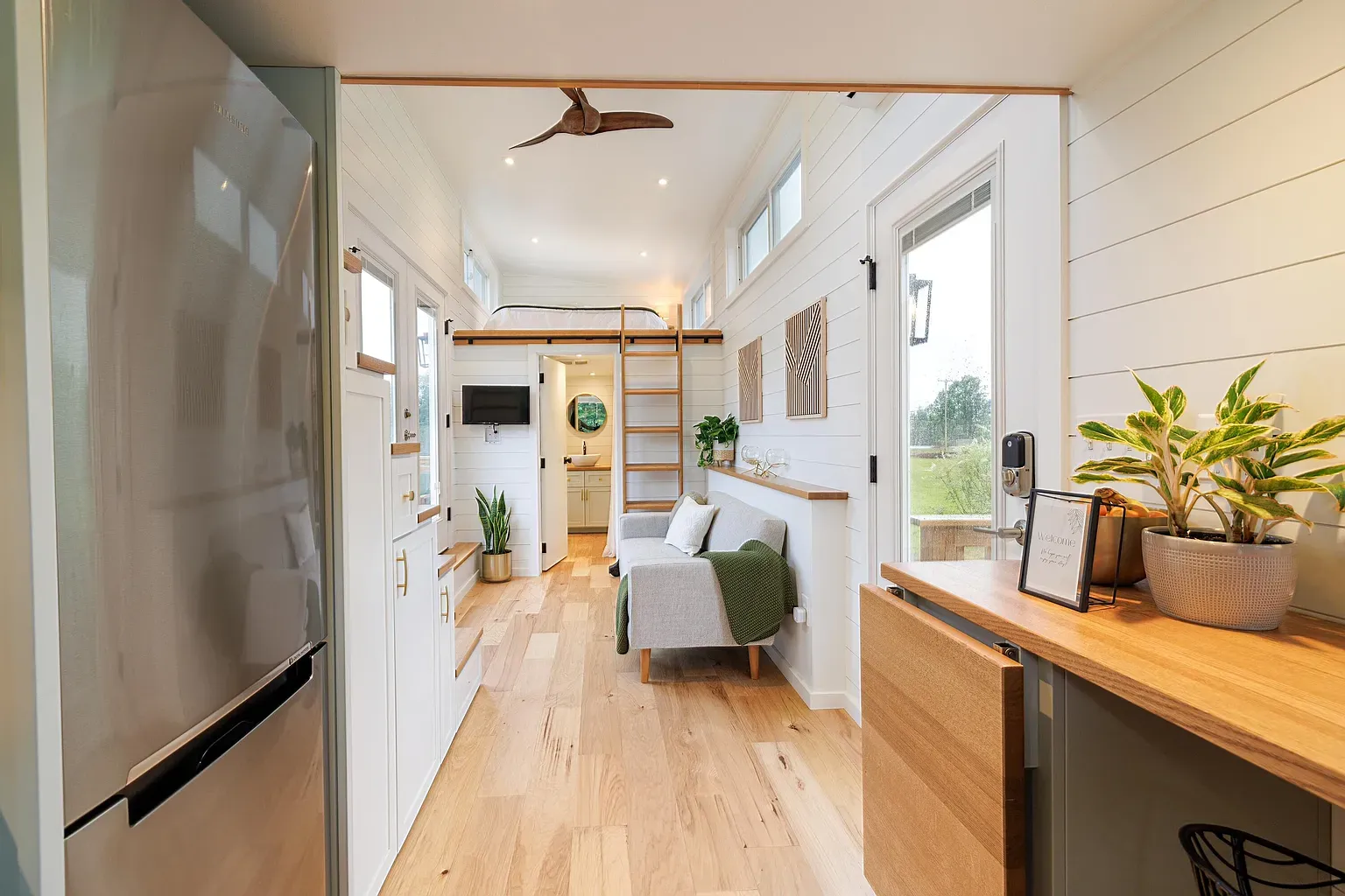 Soft whites and wood. Shiplap everywhere. Feels bigger than it is.