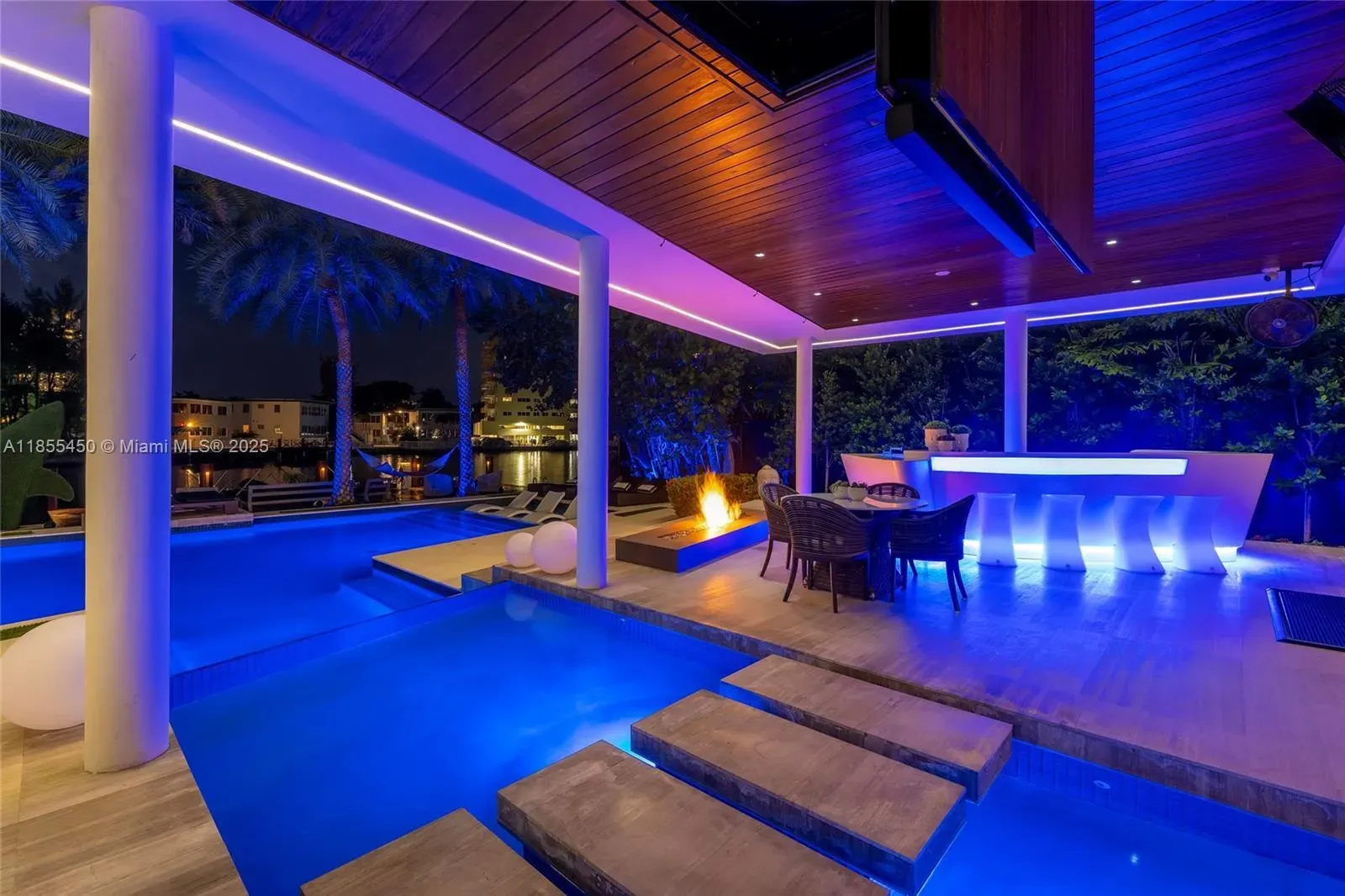 Then this outdoor bar—glowing countertop, slick stools. Looks vacation.