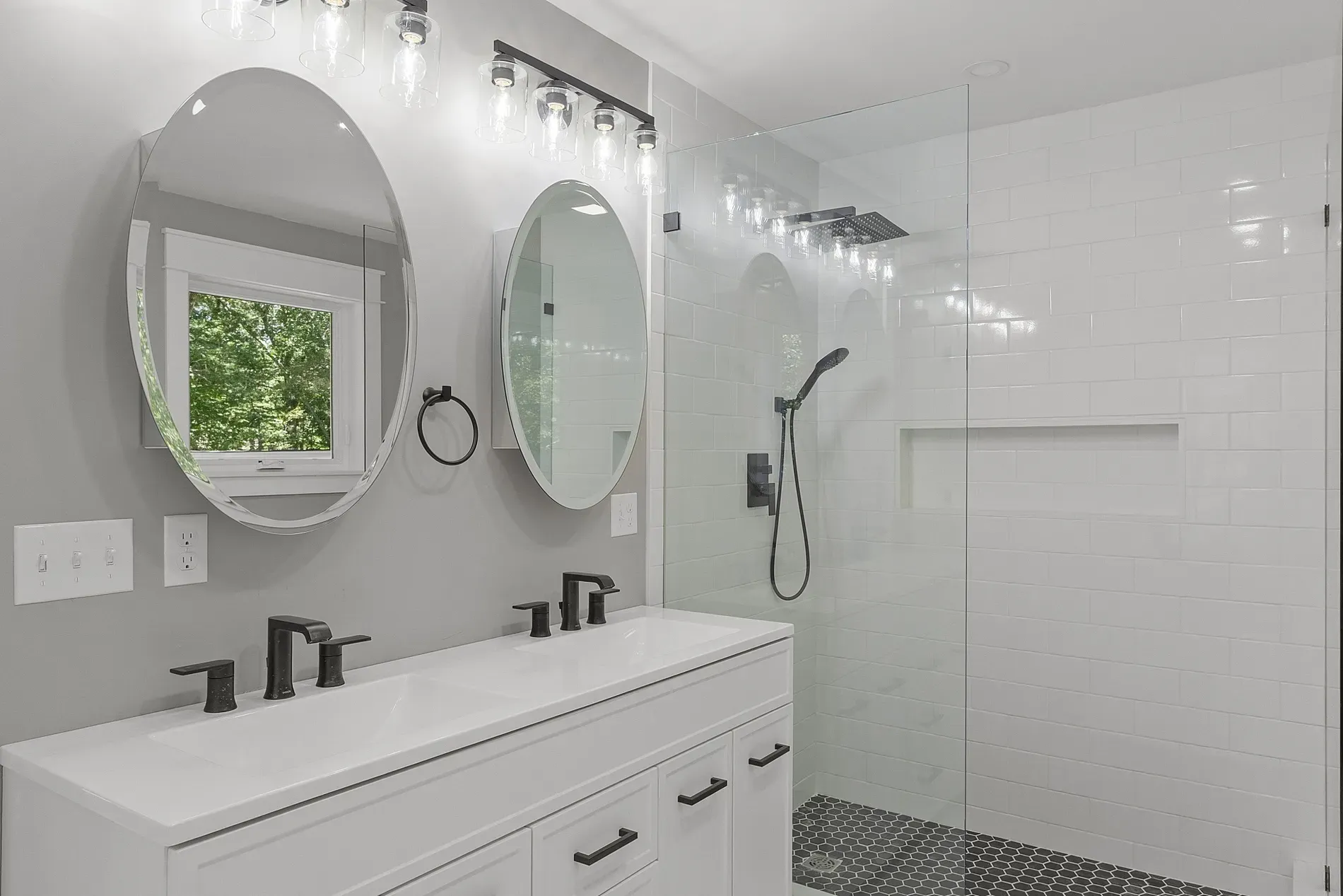 Double vanity with quartz top—clean, simple, actually useful storage.
