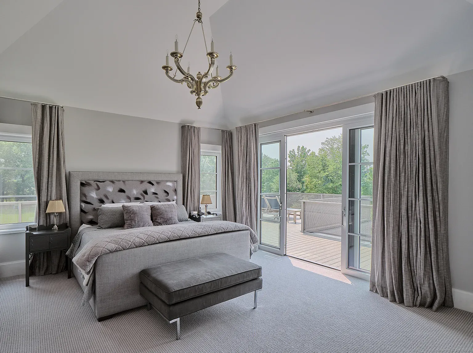 Bedroom is clouds-on-clouds—tufted headboard, muted tones, hotel bedding energy.