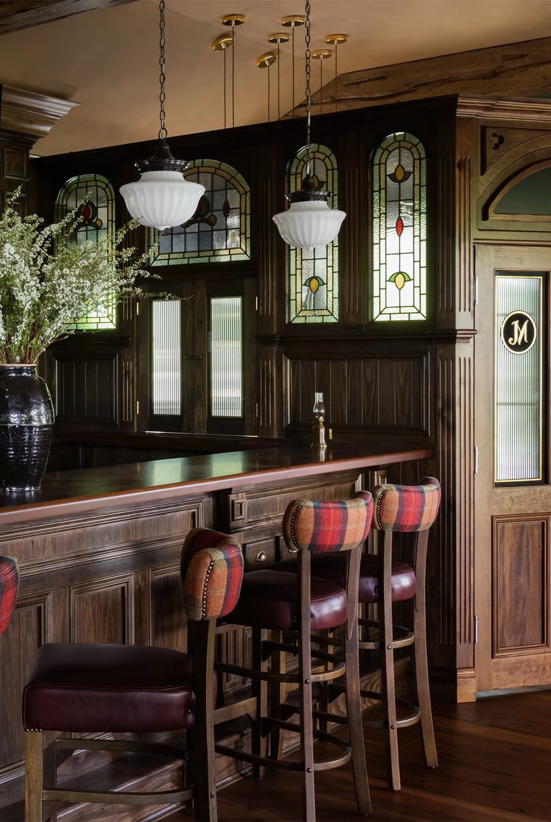 Rich wood bar glows. This would ruin my Dry January immediately.