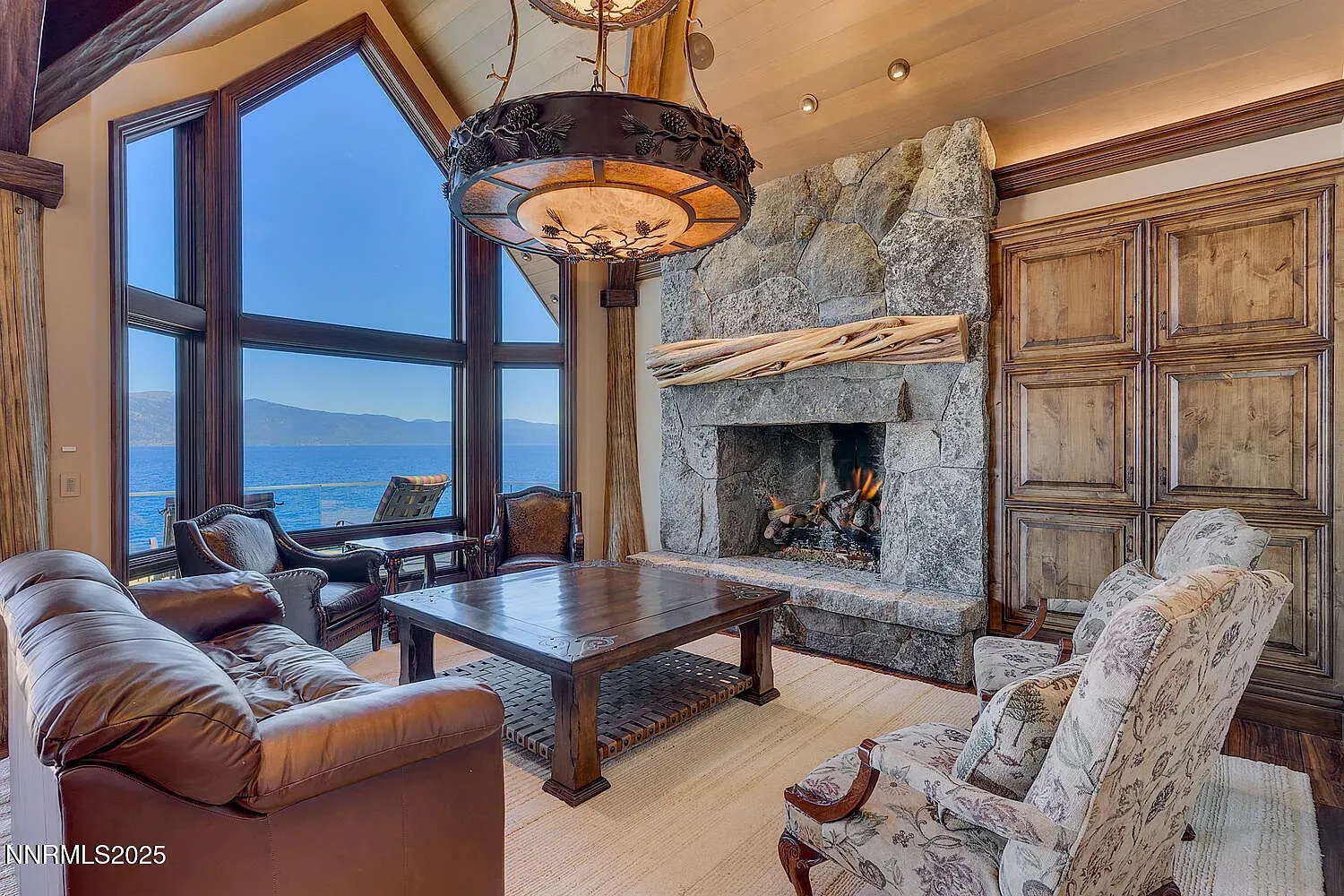 Massive boulder fireplace says winter is handled. I’m bringing soup and a book.