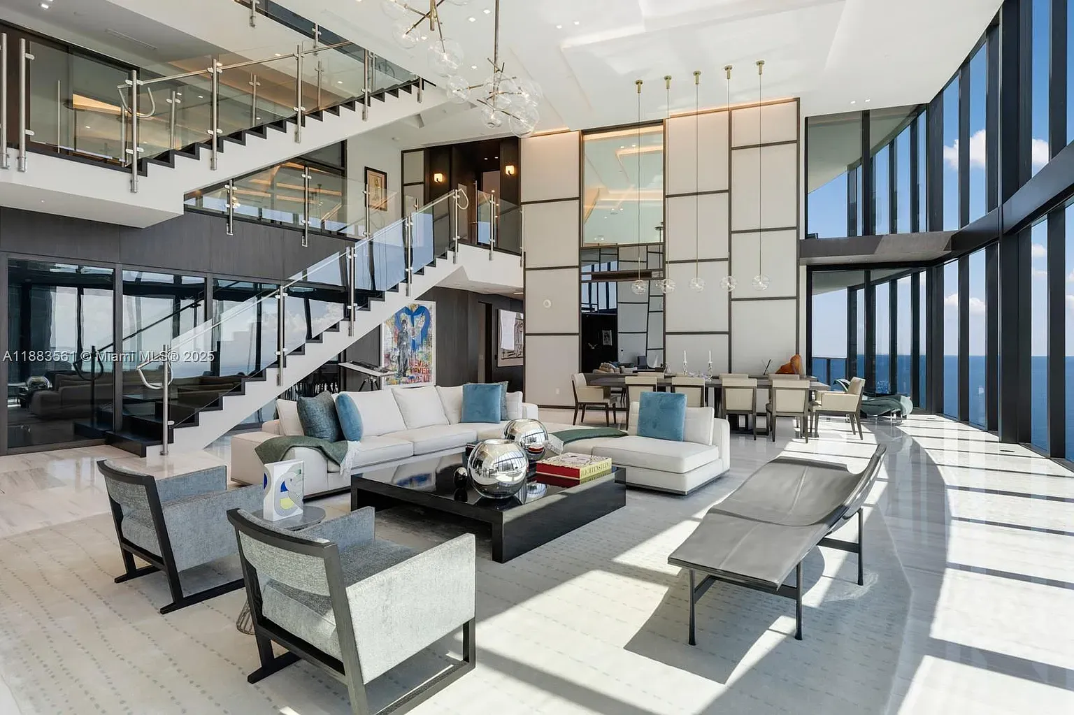 From this angle, ceilings feel endless. Windows swallowing the skyline and ocean.