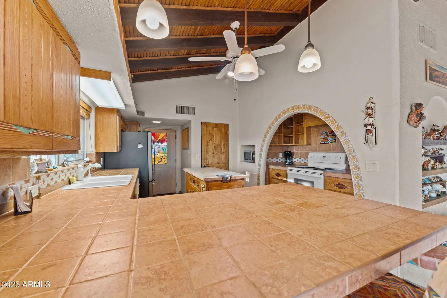 Kitchen beams for days. Chunky wood island looks it could survive anything.