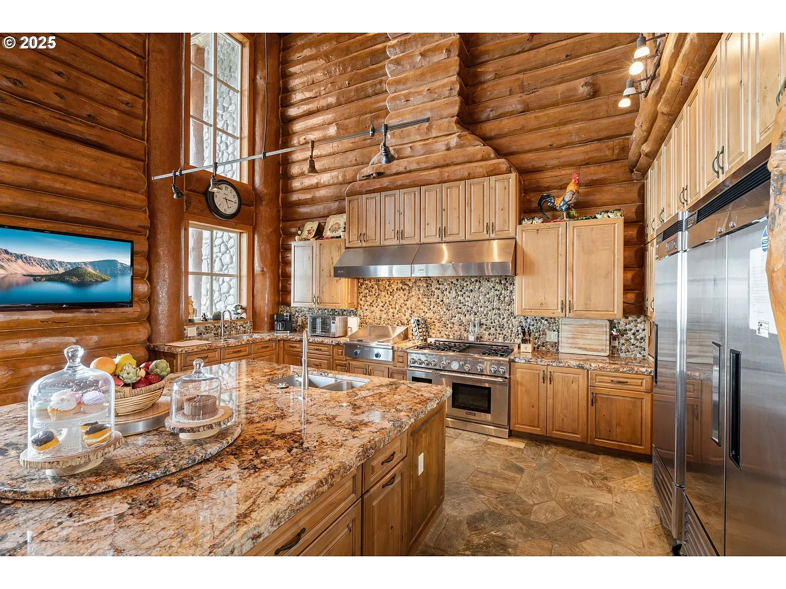 Kitchen daylight hits the logs just right. Simple, warm, everything within reach.