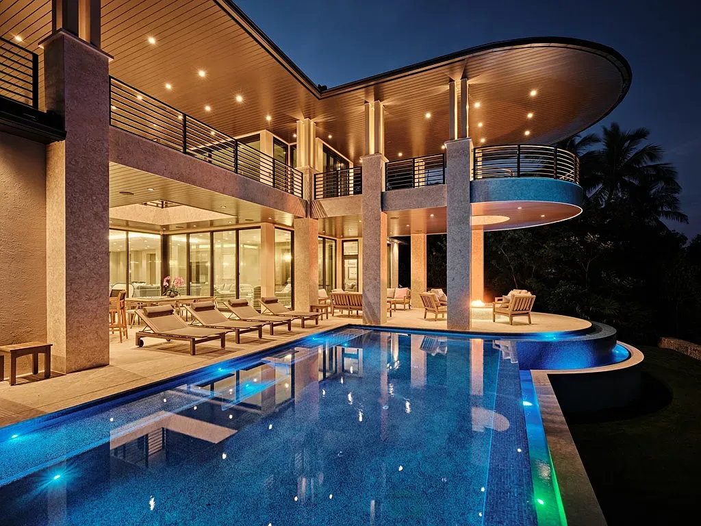 Another exterior angle. curved rooflines doing acrobatics. Big glass, big views, resort energy.