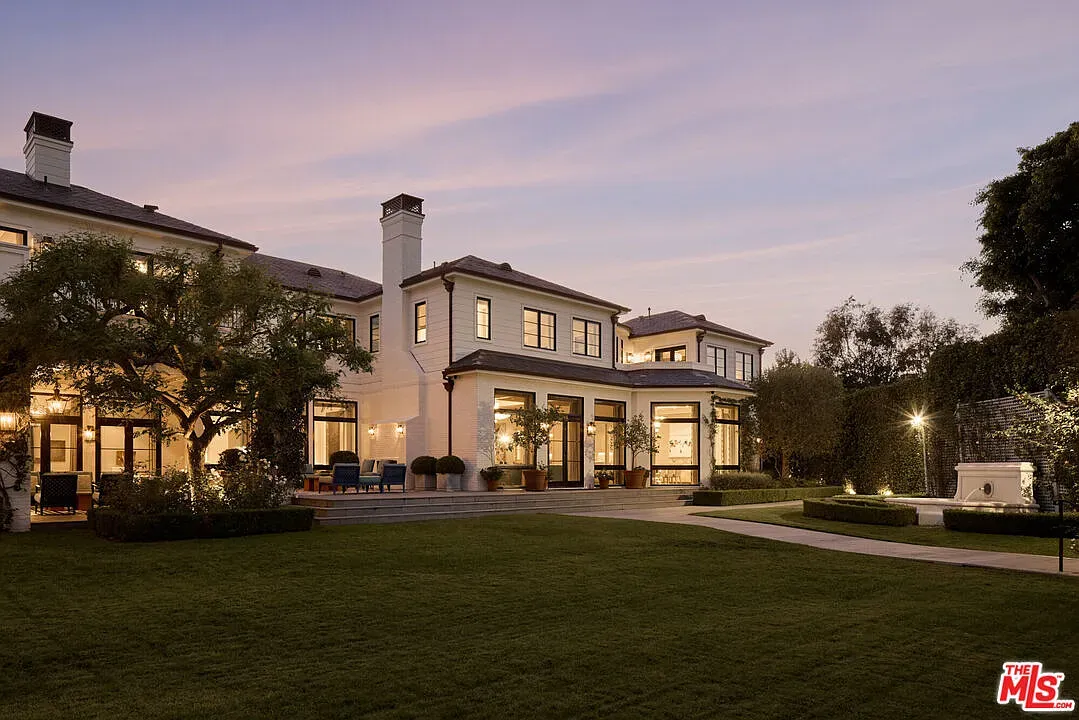 Back outside—big modern mansion, soft tones, tons of glass.