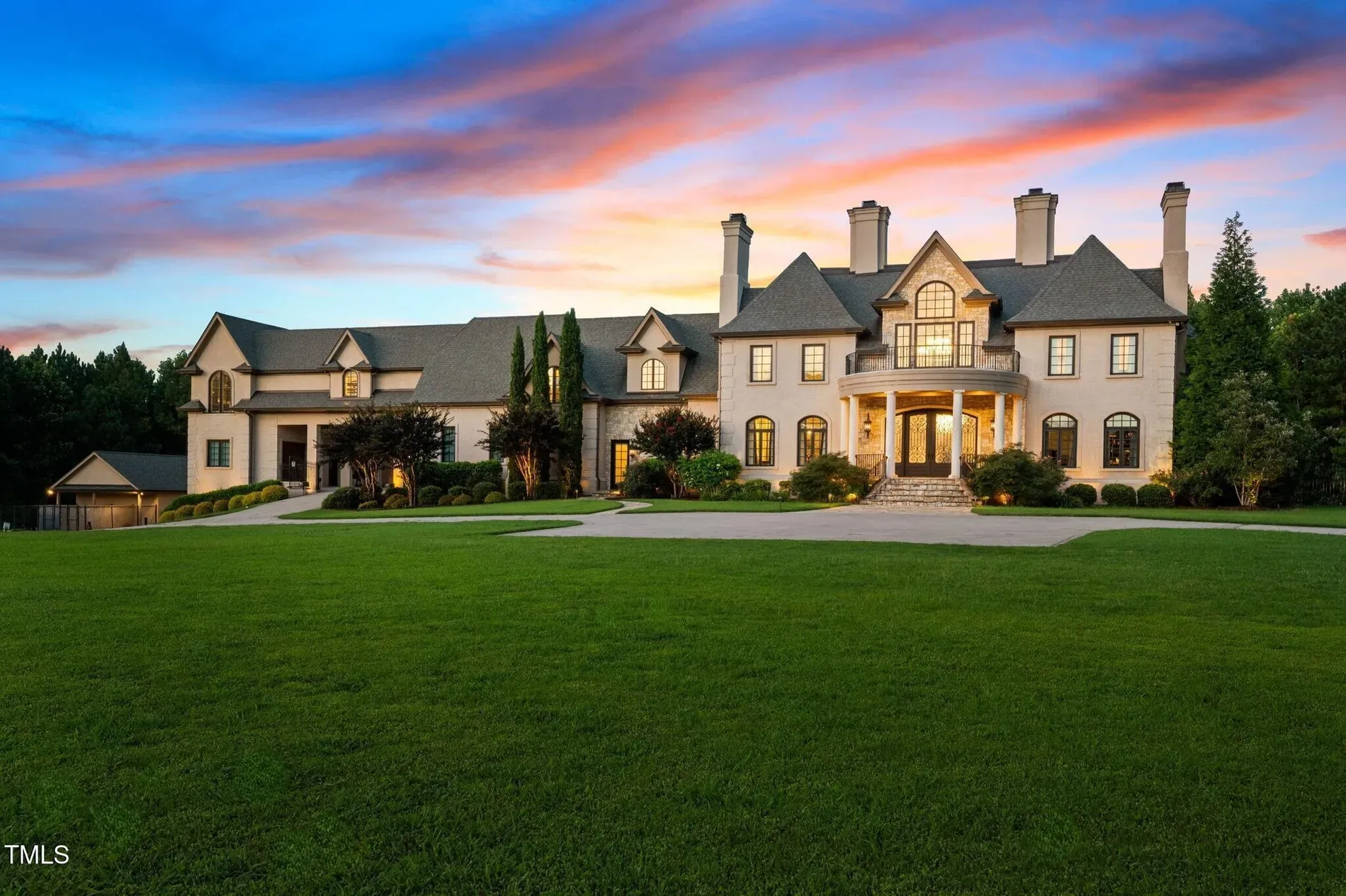 Front elevation flex—stone and gray, big white columns. Feels courthouse-chic.