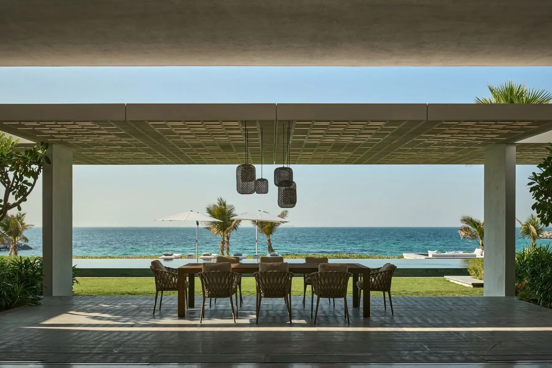 Covered dining terrace—concrete slab roof, breezy and shaded. Perfect for long lunches.