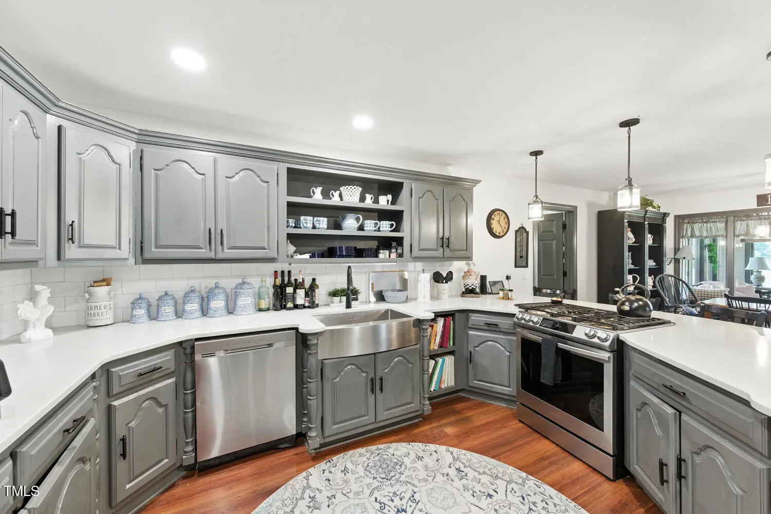 Soft gray cabinetry with white counters. Looks fresh. Anyone else over all-white kitchens?