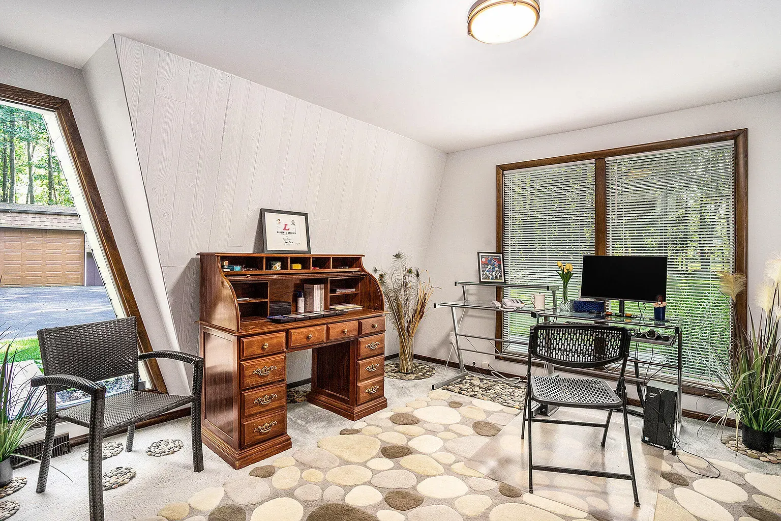 Angled wall makes this office feel cool. Big window doing overtime.