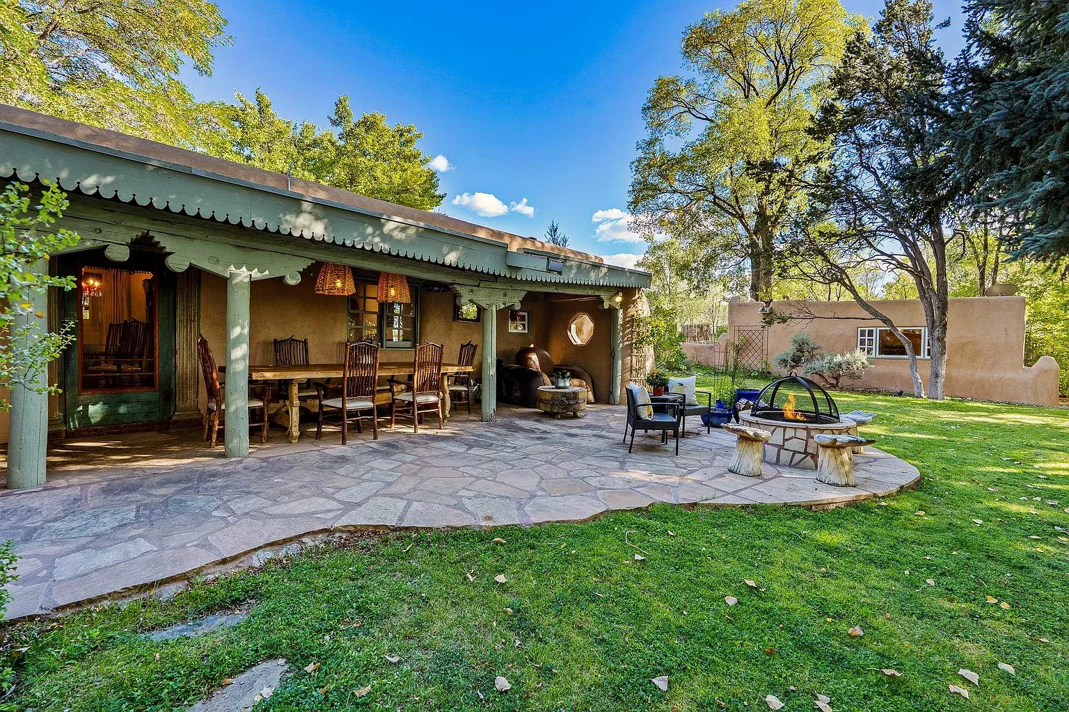 Flagstone patio meandering a creek. Adobe keeps the warmth.