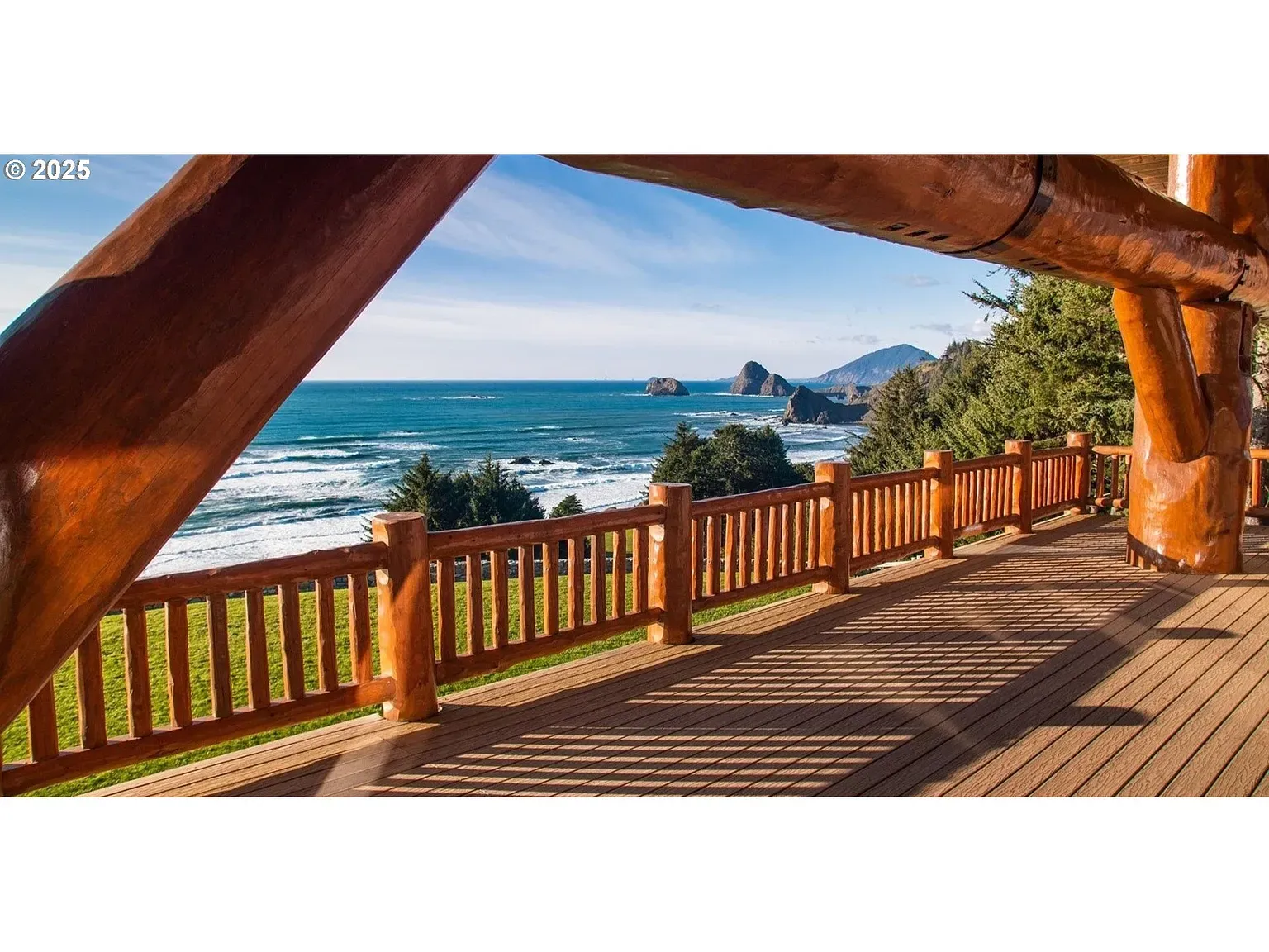 Deck with ocean views for days. Wood planks look freshly oiled.
