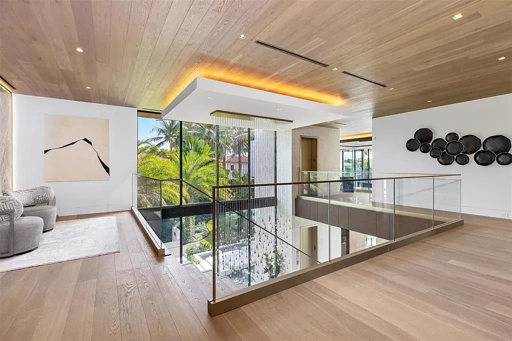 Open loft, pale oak floors. Not sure about these endless ceiling slats.