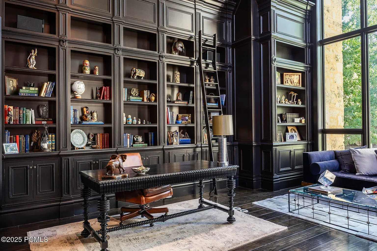 Here's the office-library wall. Floor-to-ceiling shelves flexing hard. I'd never leave.