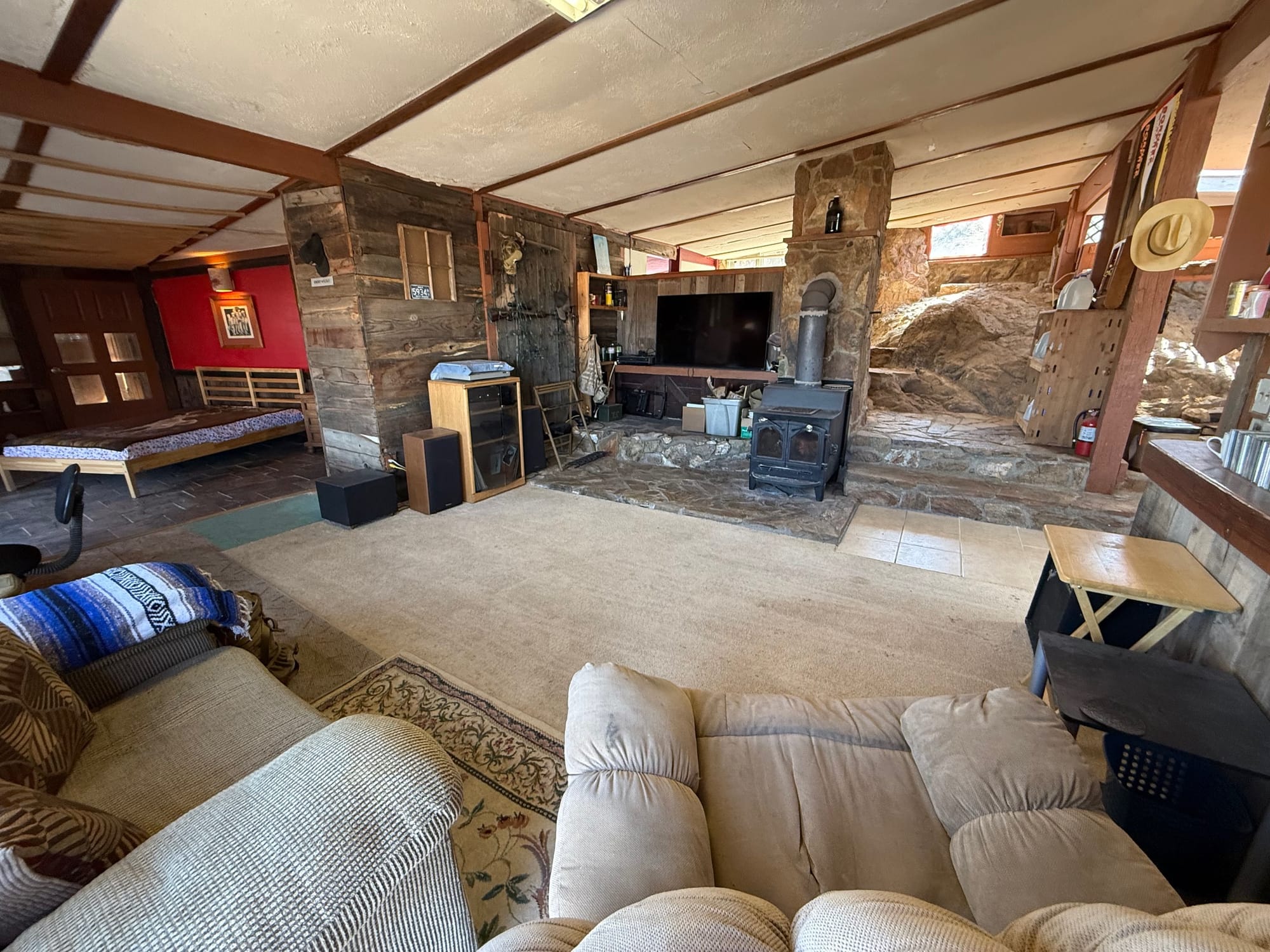 Cozy cave vibes, big stone fireplace doing all the heavy lifting.