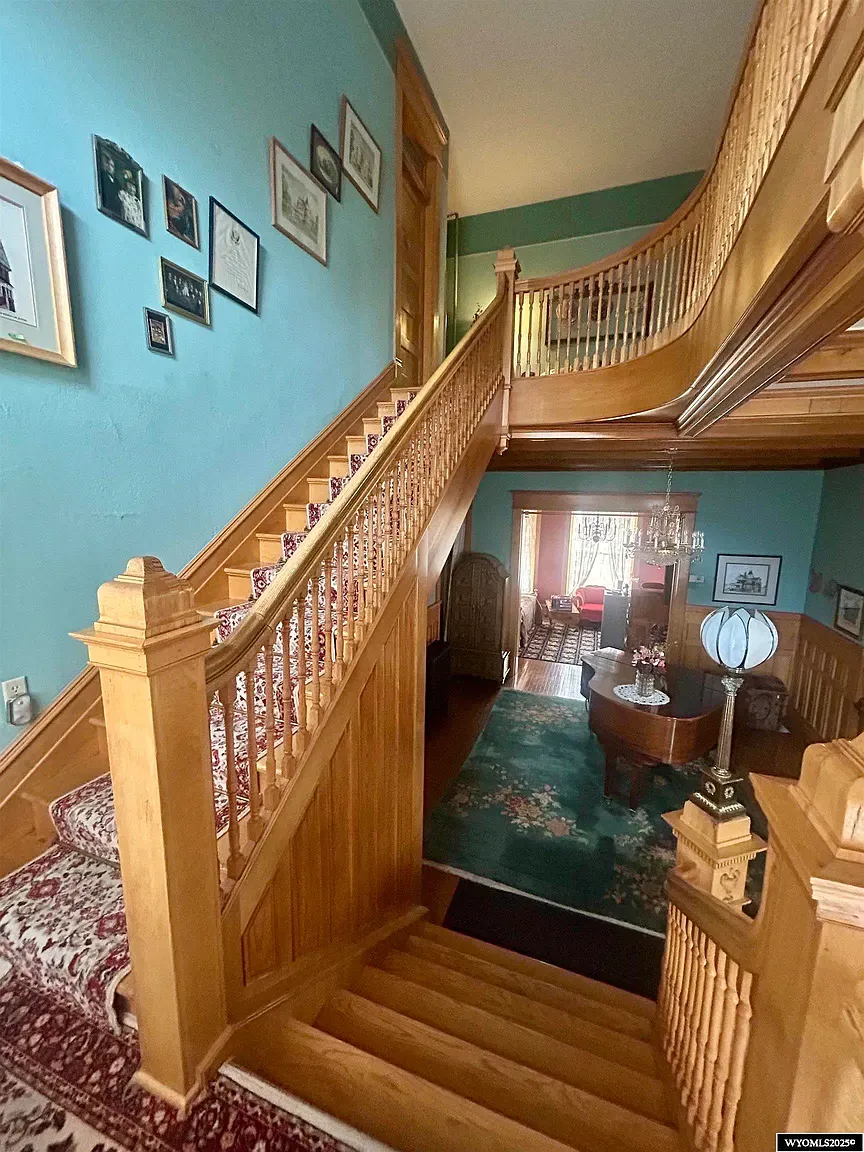 The foyer flexes that curved staircase and runner. I’d never leave this landing.