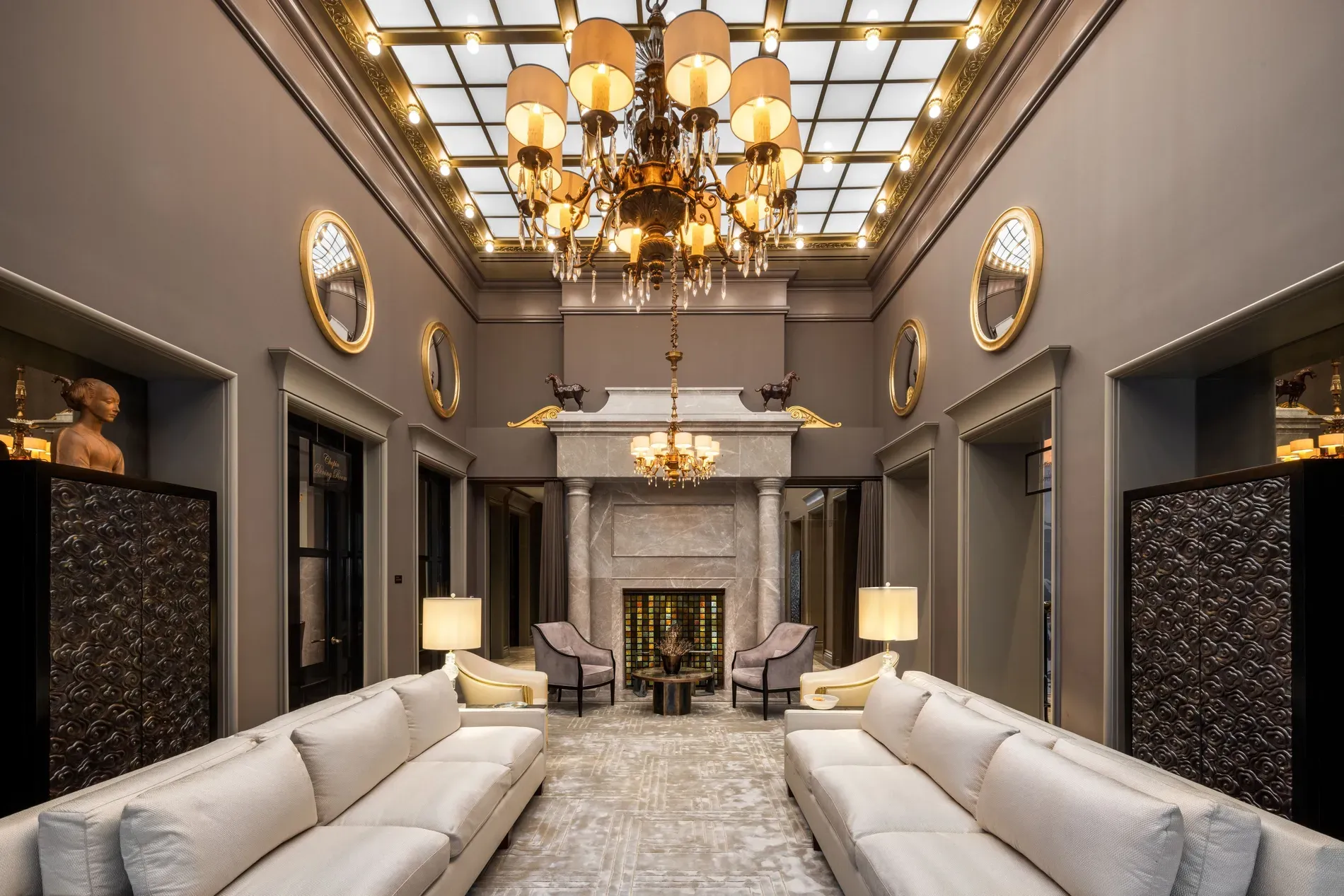 Glass ceiling and statement chandelier. Dramatic, but dusting that thing? Nightmare.
