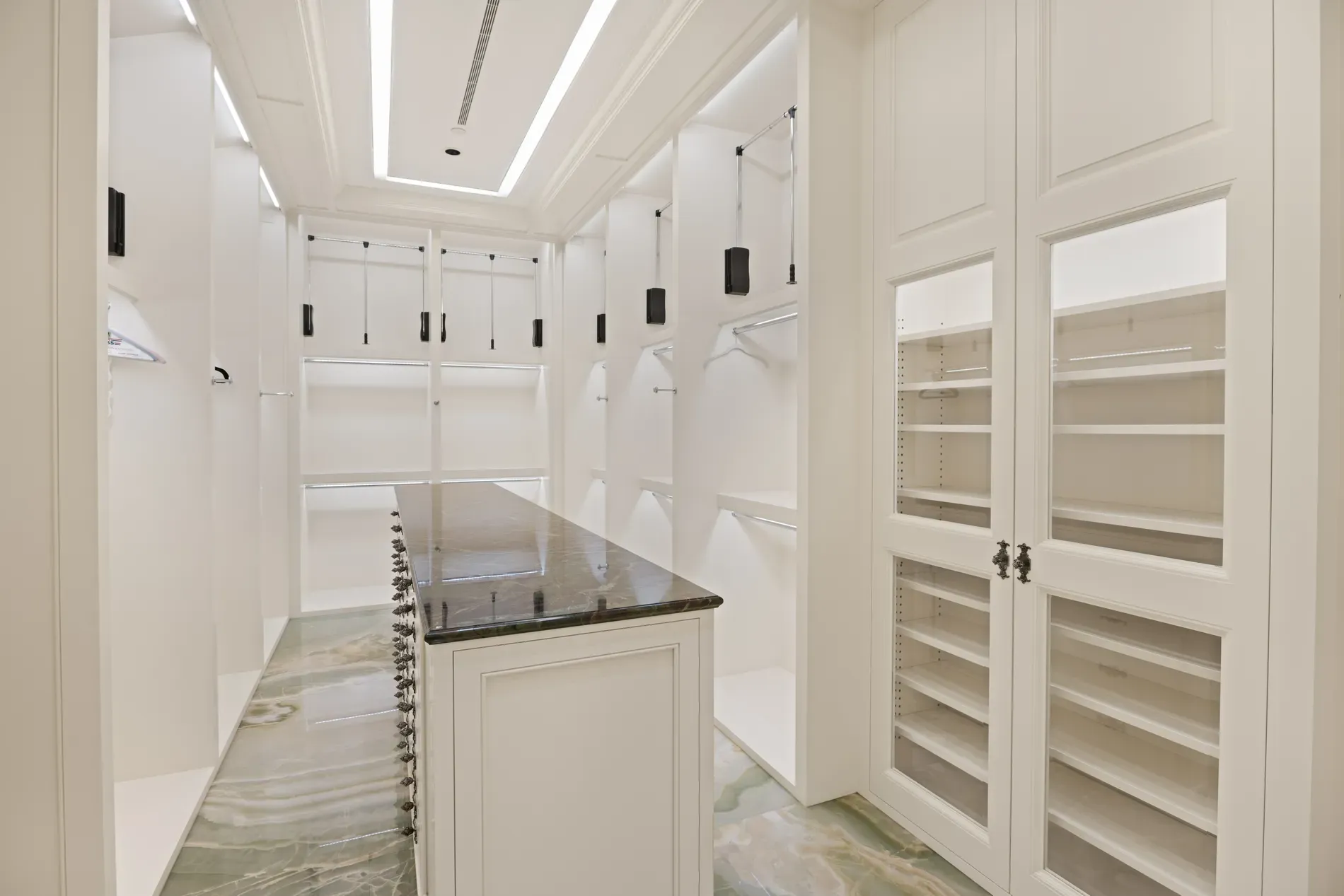 Closet goals. Soft lighting, clean lines. I'd actually keep things folded.