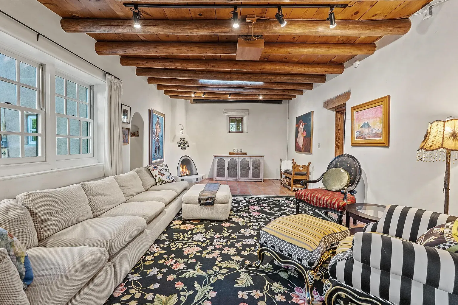 Living room glow from that log ceiling. Unique and cozy.