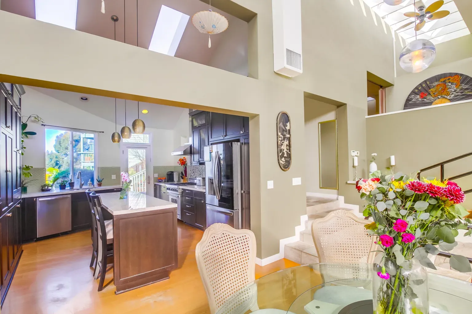 Dark kitchen cabinets against light floors. Solid contrast, looks practical too.