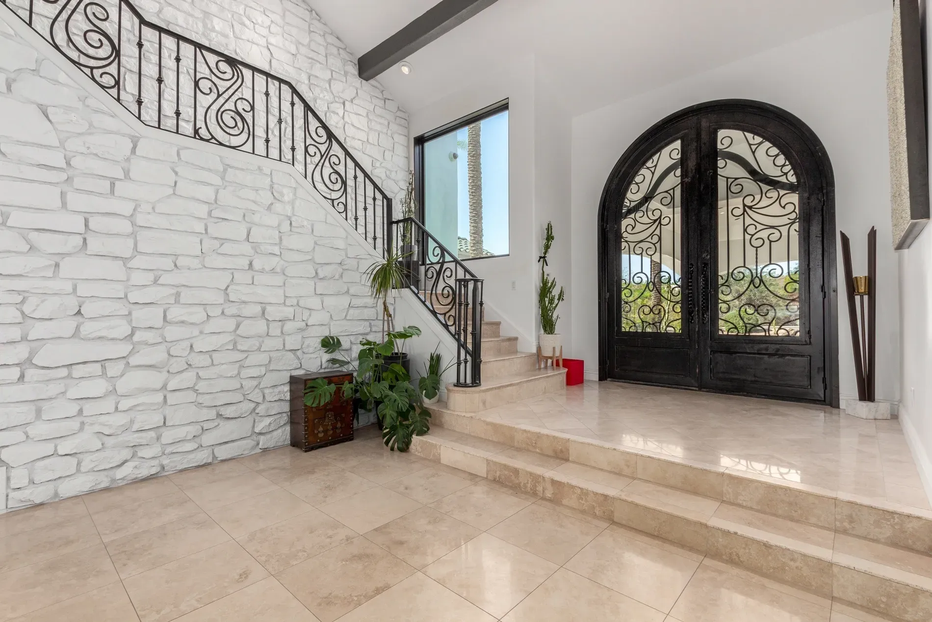 Here's the entry — huge iron-detailed doors. Feels fancy, maybe hotel-adjacent?