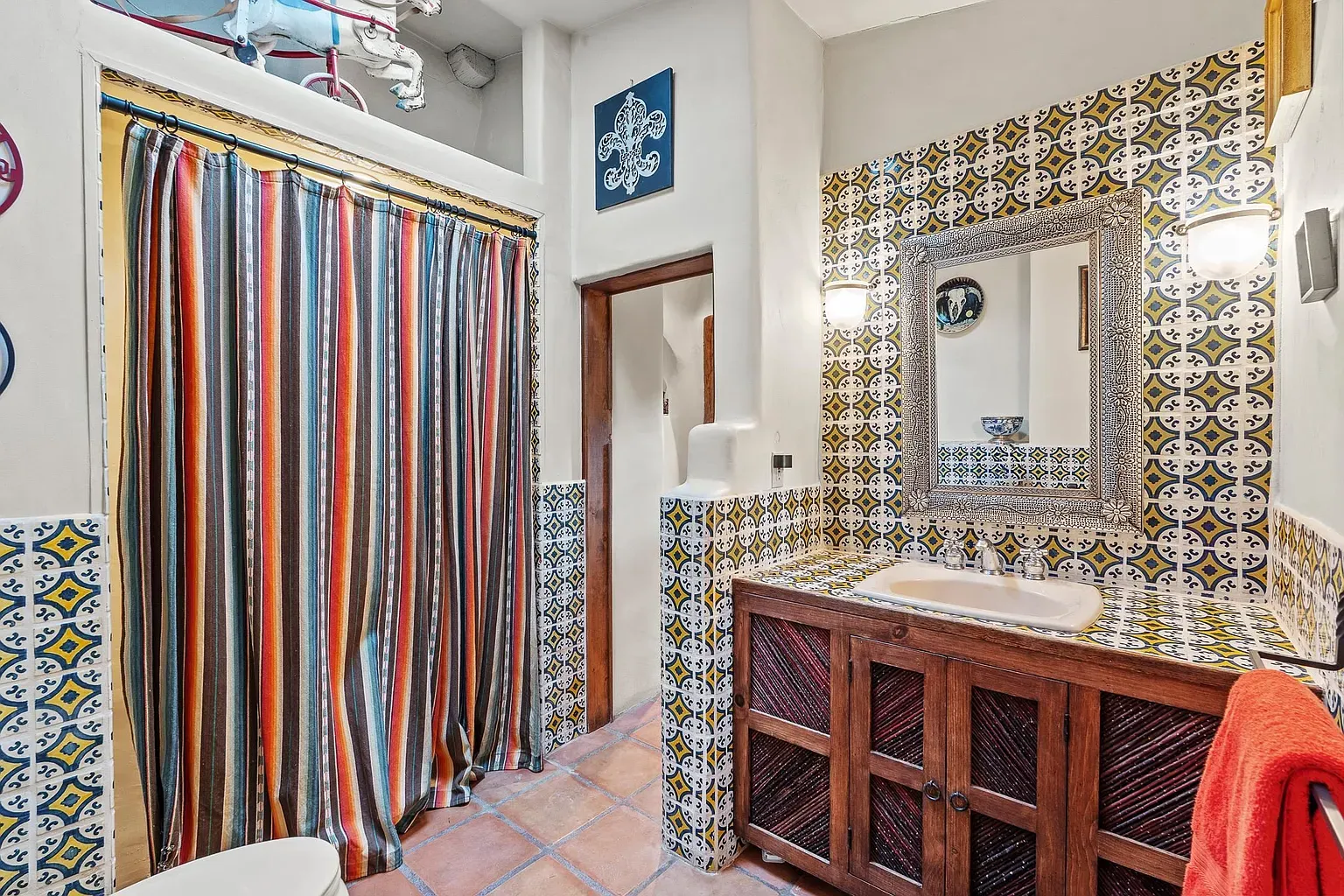 Color explosion bathroom. Blue, yellow, white, a tile fiesta.