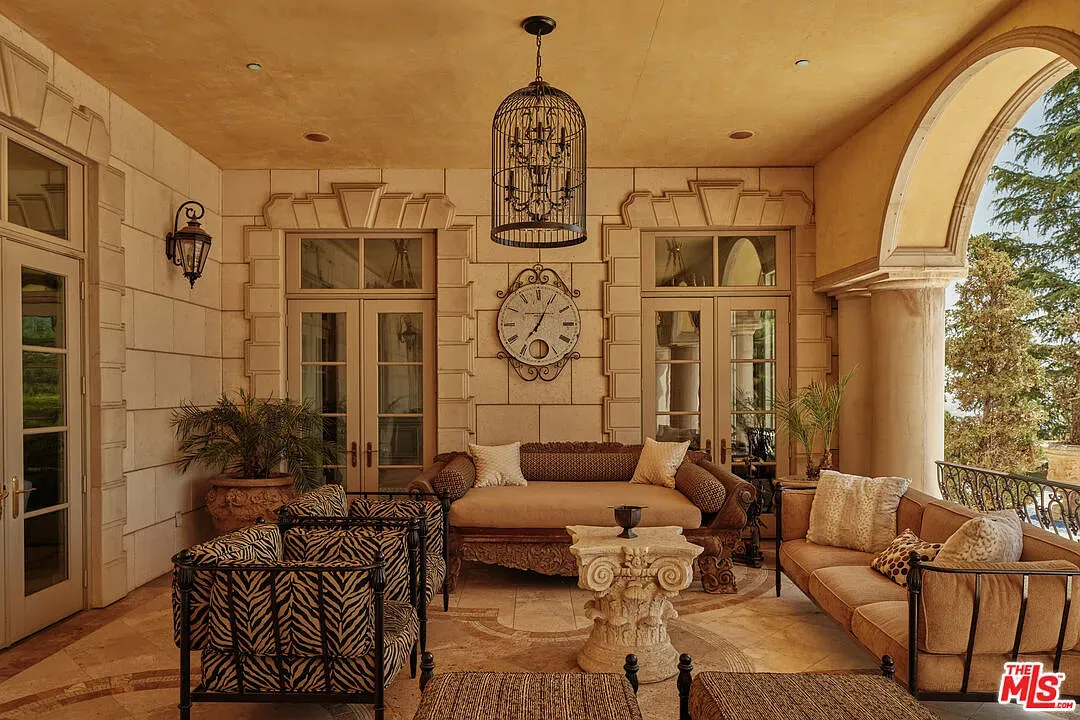 Covered lounge with a textured ceiling. Not sure about beige-on-beige, but calm.