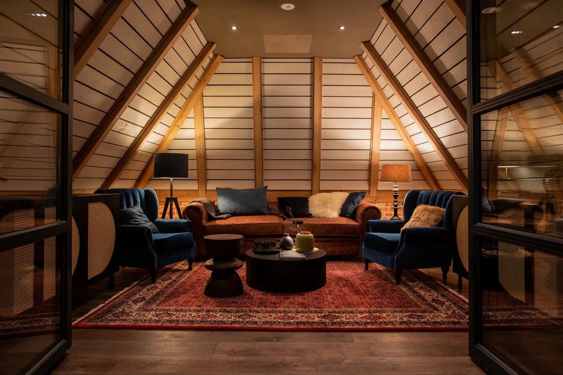 A-frame room making the beams the star. Cozy but airy.