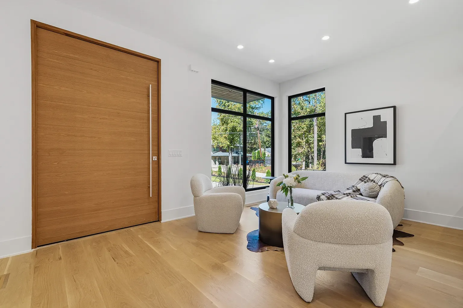 Those twin floor-to-ceiling windows are wild. The light in here is unreal.