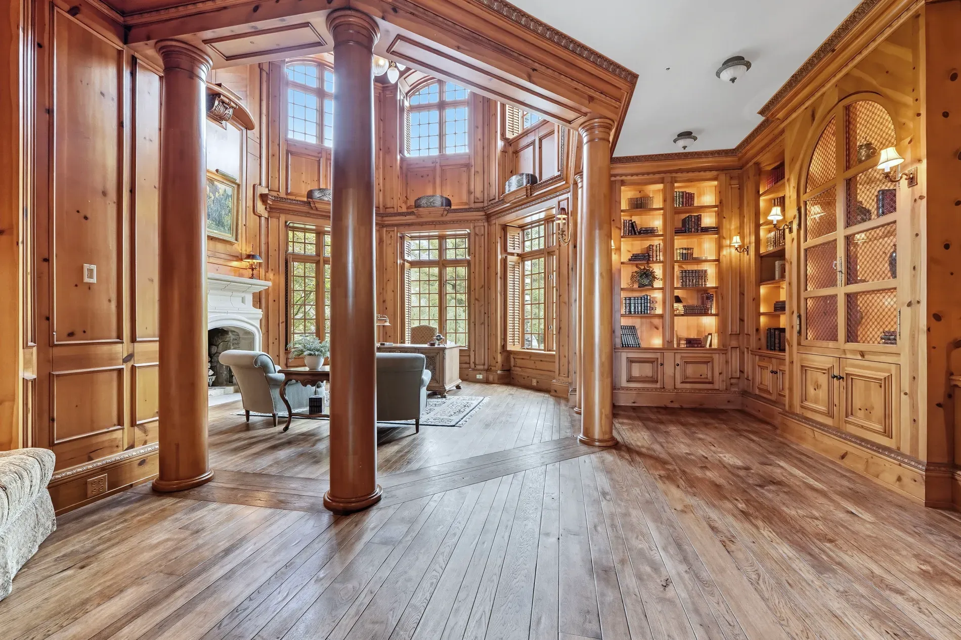 Wall-to-wall wood, columns, coffered ceiling. Rich library energy.