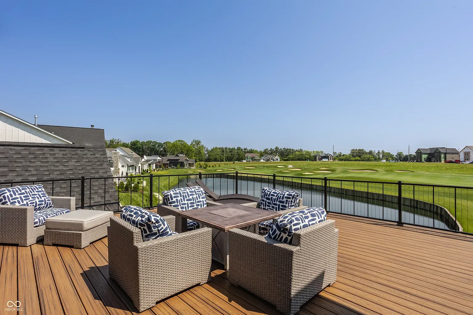 Deck goals. Wicker chairs with navy cushions and shade for lazy Saturdays.