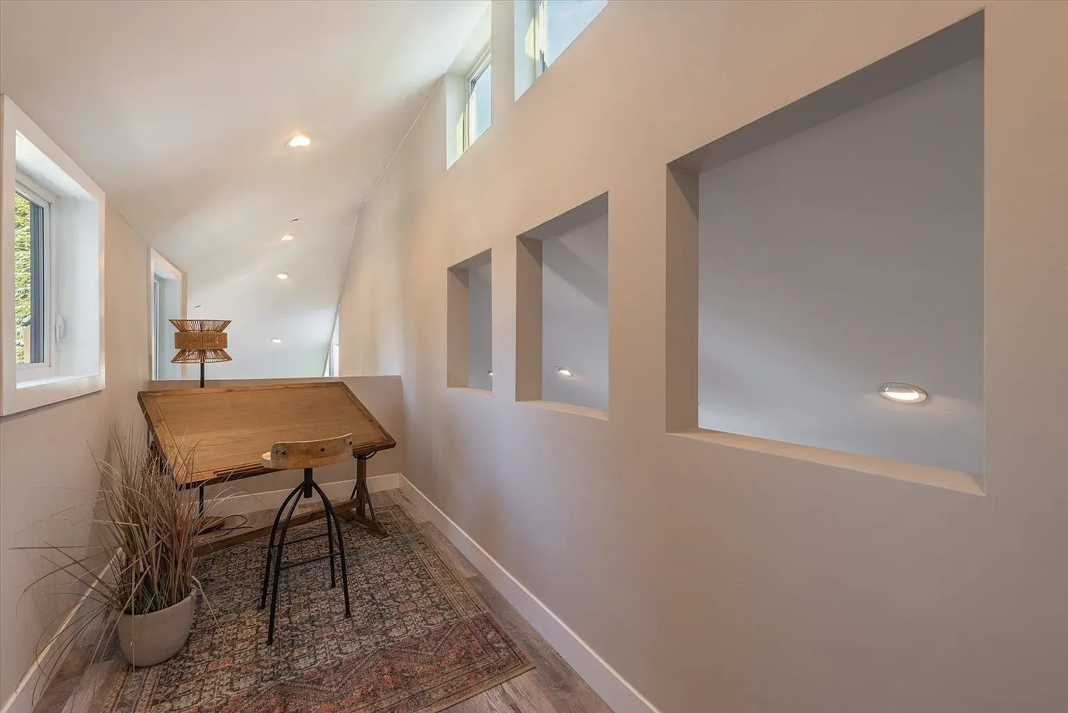 Loft vibes with the slanted ceiling. Light everywhere, super airy.