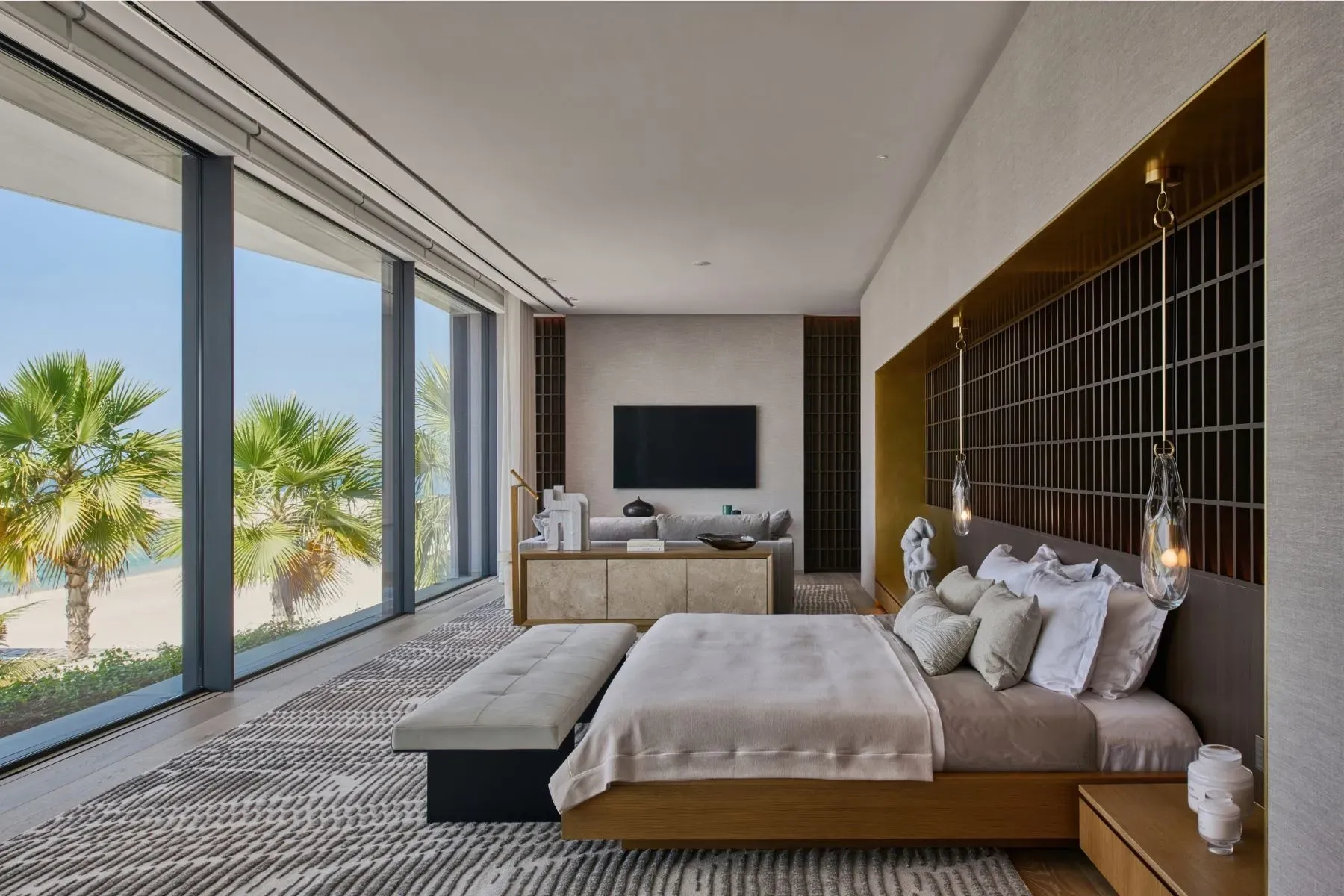 Waking up to palms and shoreline. Textured walls keep it cozy.