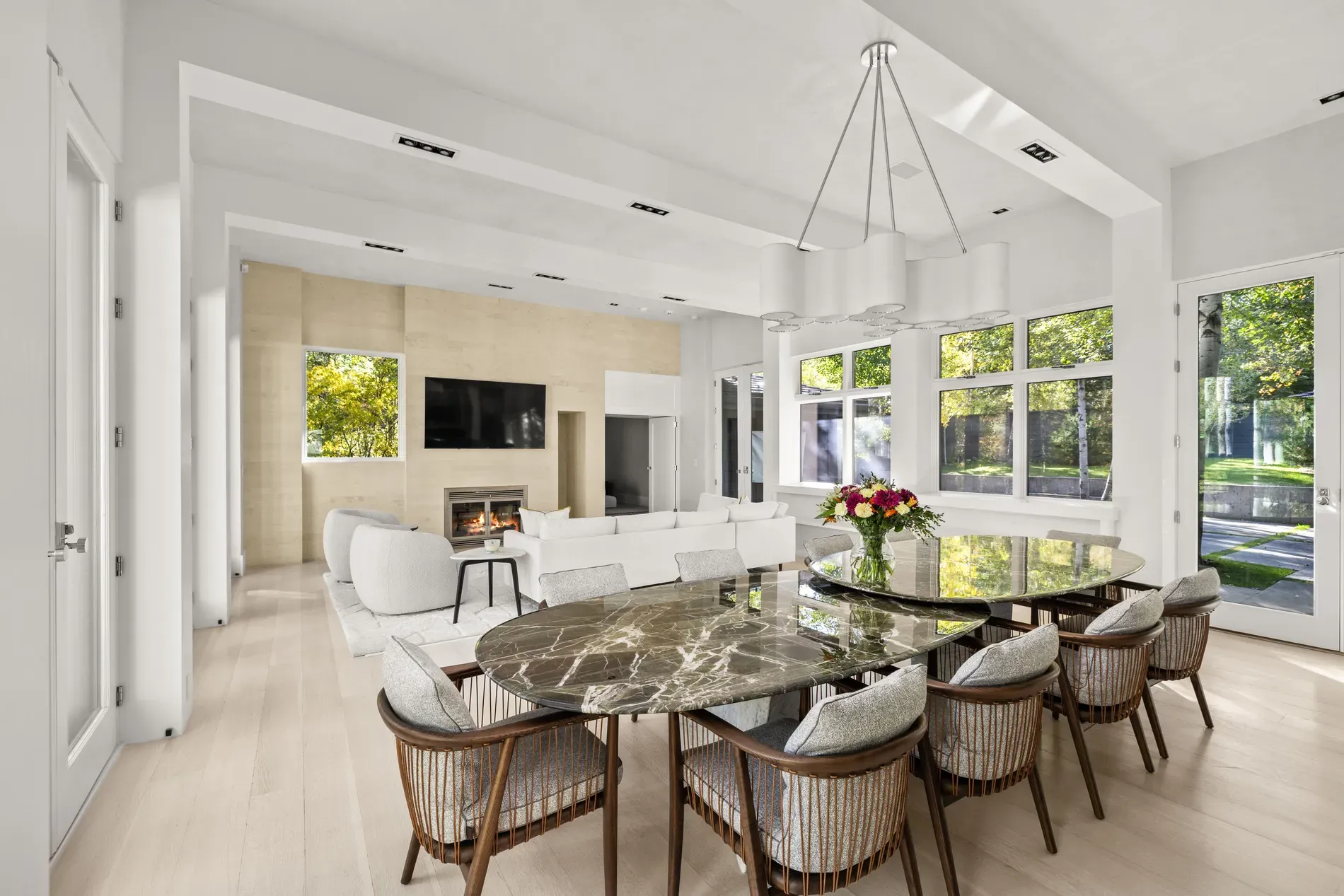Here's the dining nook — black marble table, rattan chairs. From this angle, fancy.