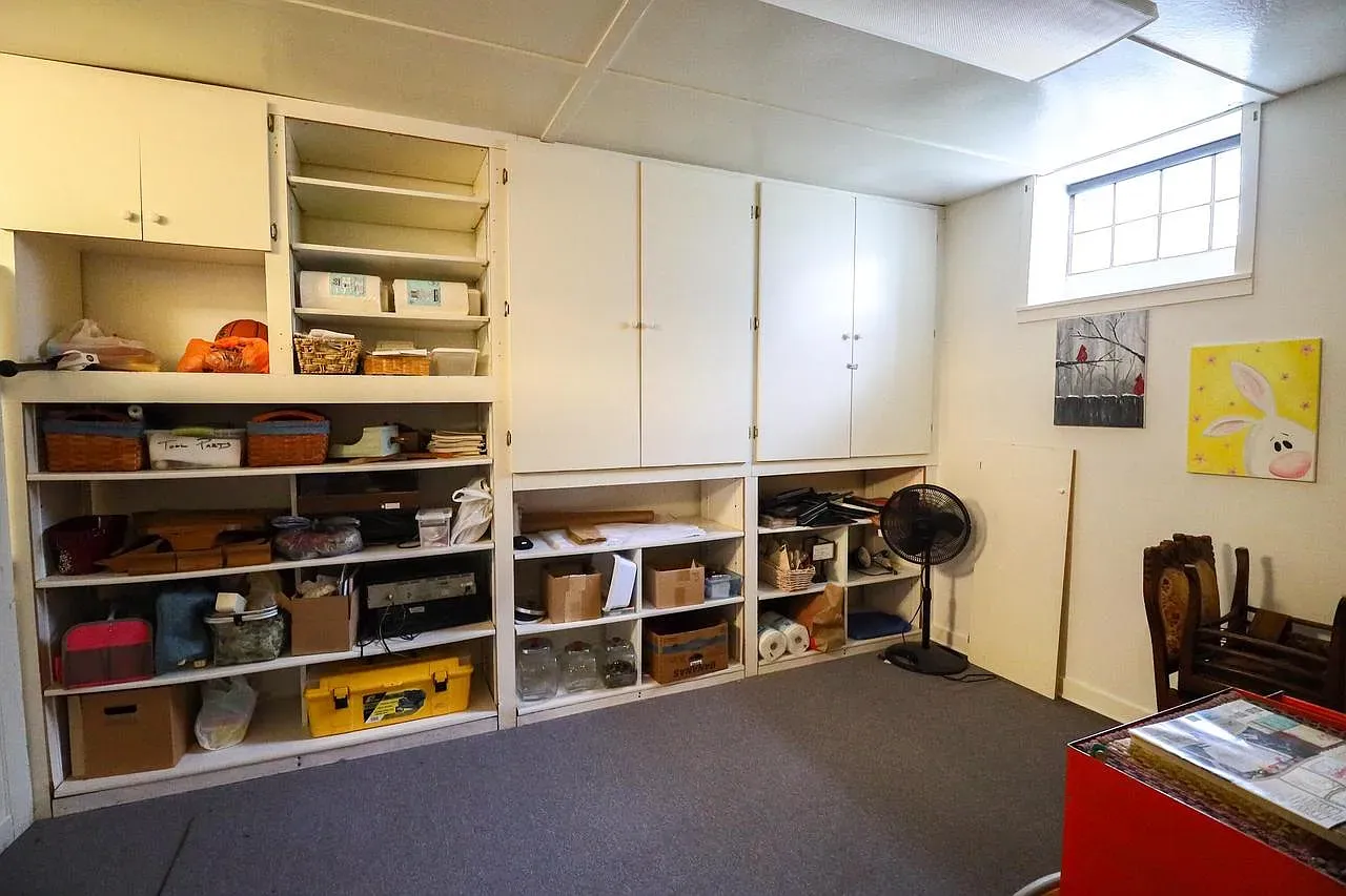 Utility zone is tidy. light walls, small grid window, everything where it belongs.