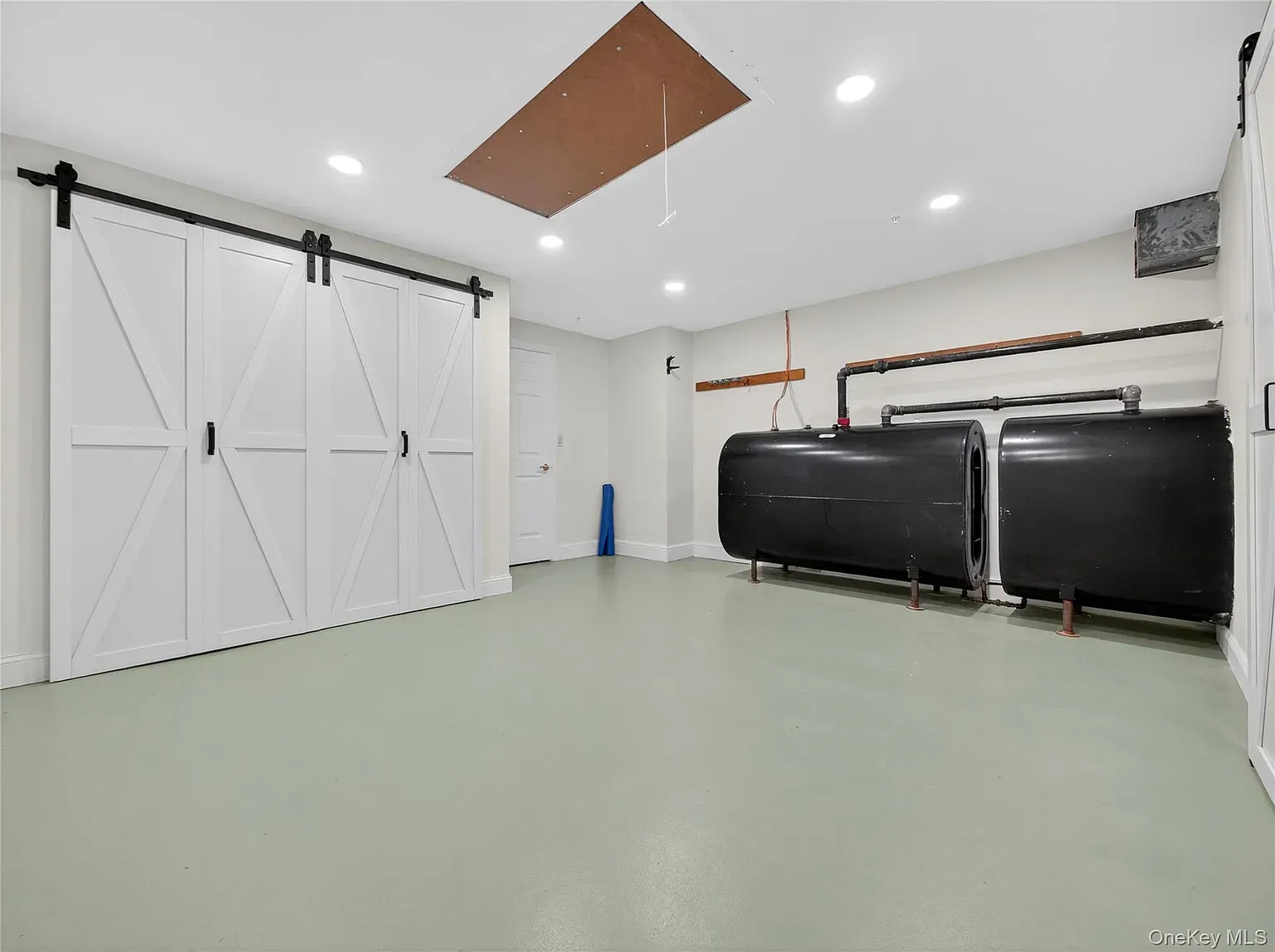 Mint-green floor surprise. Garage, studio, or roller rink energy.