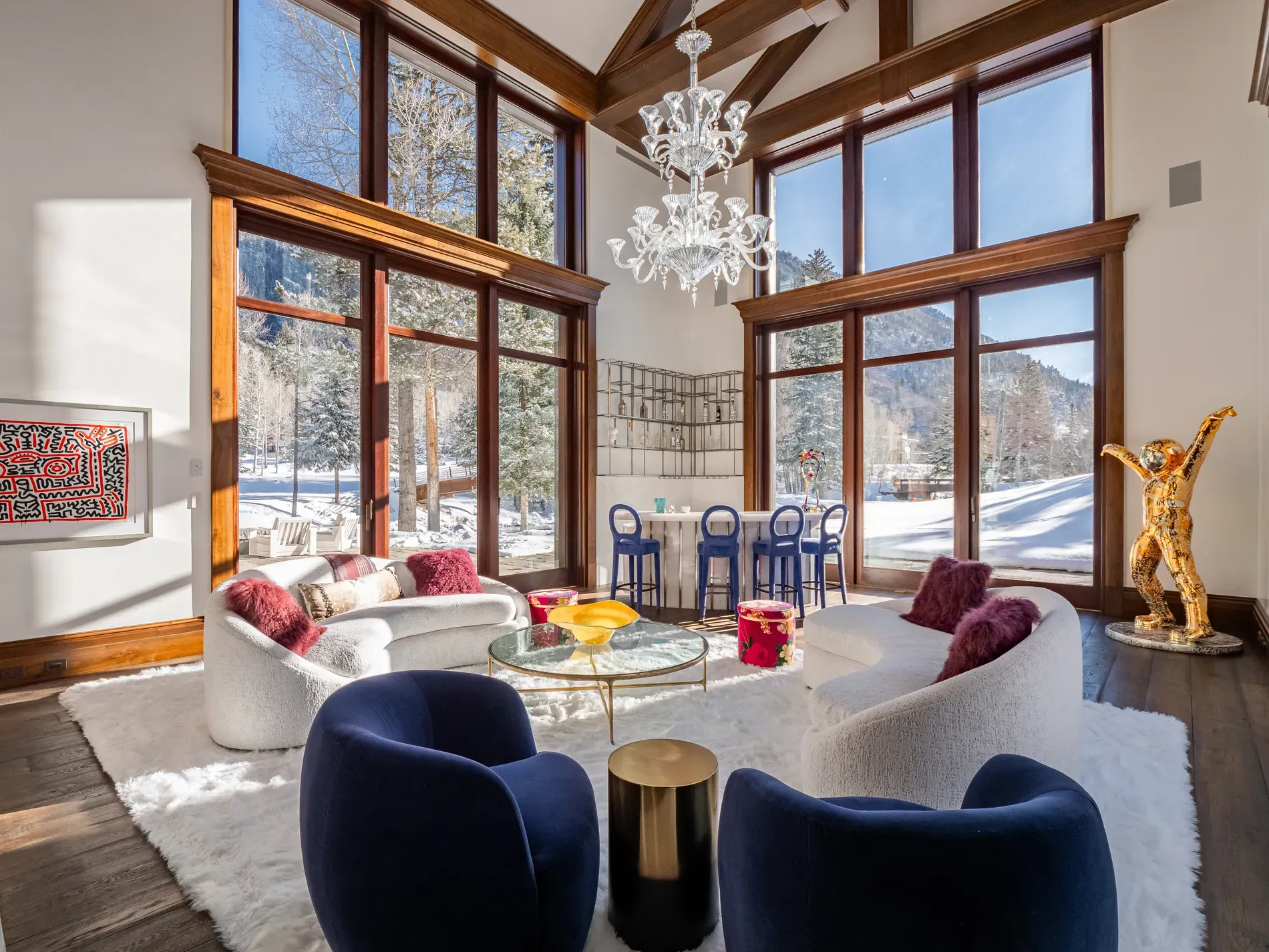 From the couch, it's just glass and peaks. That vaulted ceiling goes forever.