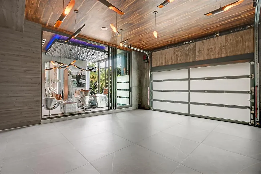 Garage you actually want to hang in. Concrete floors, wood ceiling, surprisingly inviting.