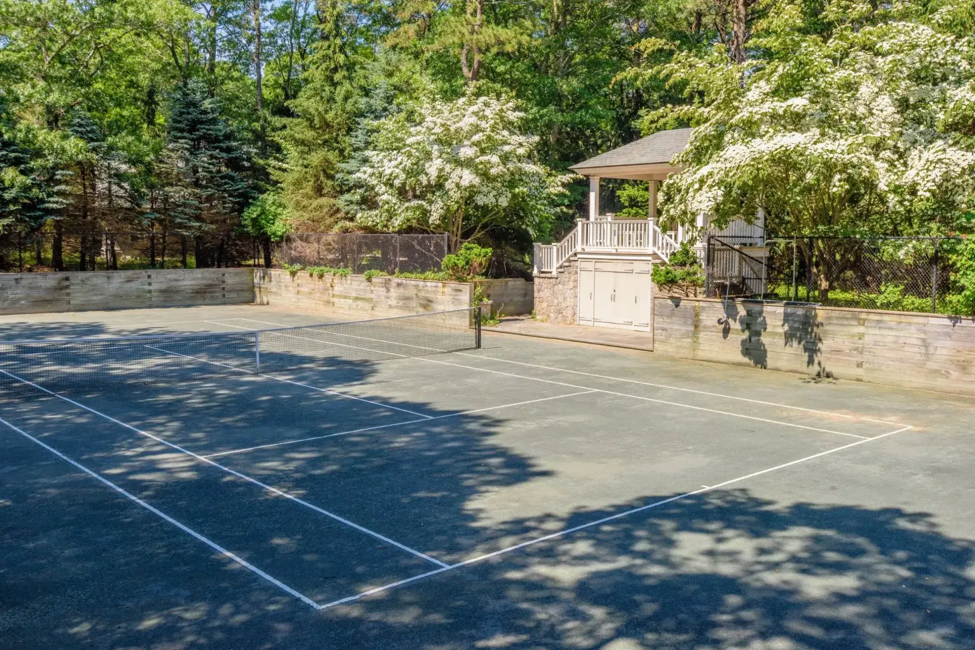 Private clay court in the trees. Lines are crisp. Who’s got next?