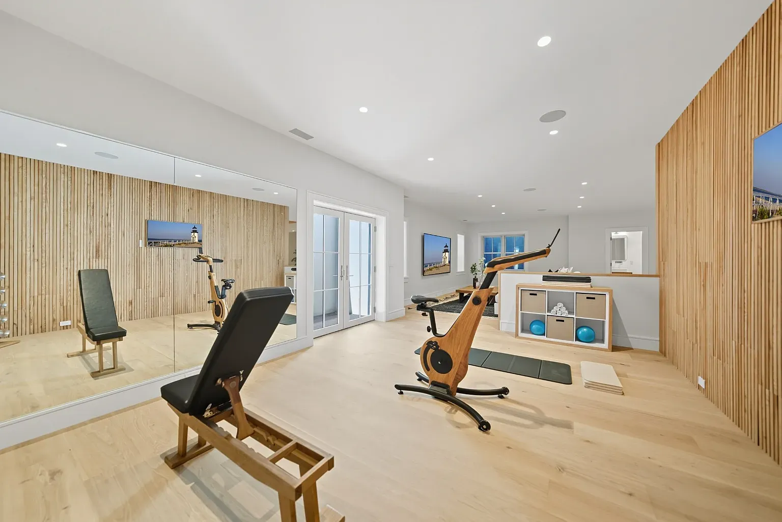 Home gym nicer than most hotels. Oak floors, slatted wall, plenty of space.
