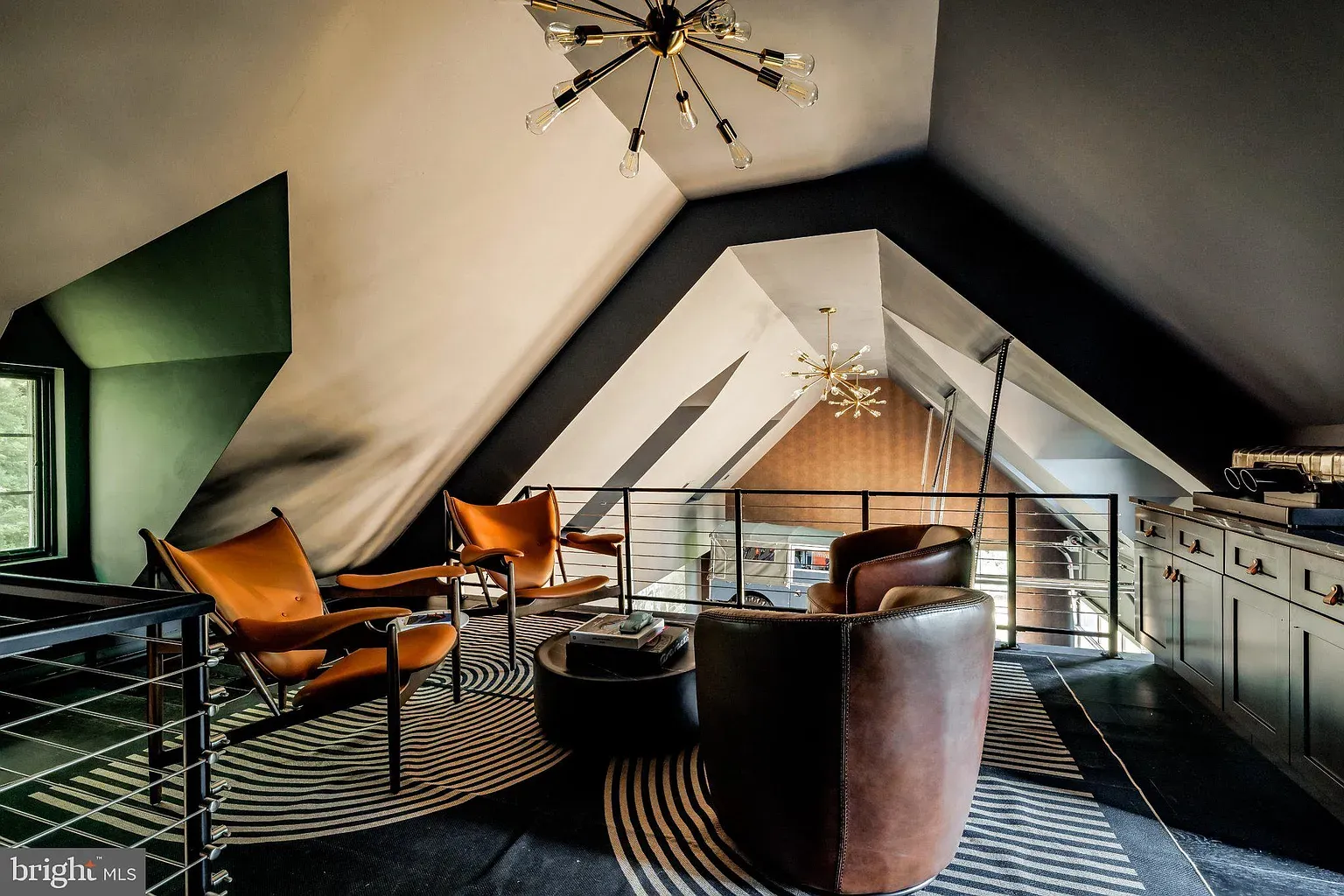 Loft angles everywhere—green and gray. Cozy but sharp.