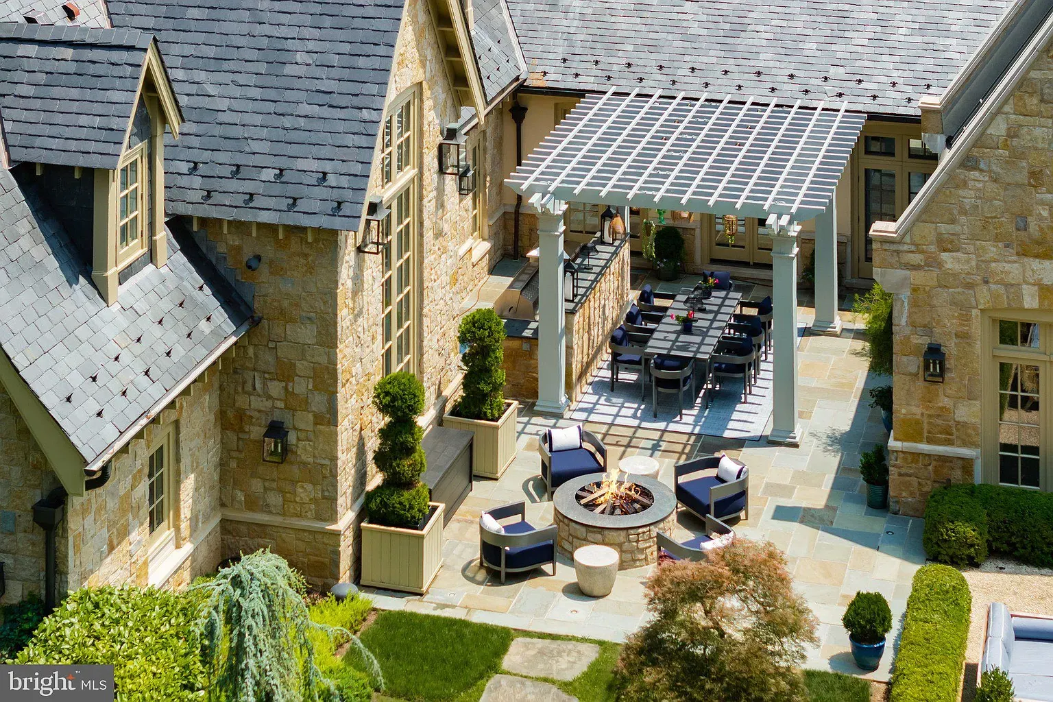 Back outside, patio against that gold stone. Feels wine-at-sunset territory.