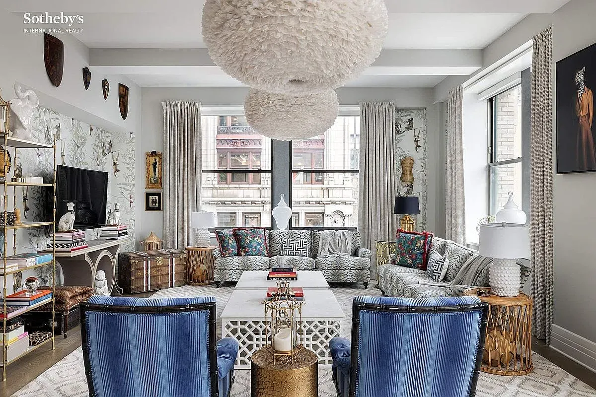 Here's the lounge — patterned wallpaper and a cozy circle of seating. Good mix.