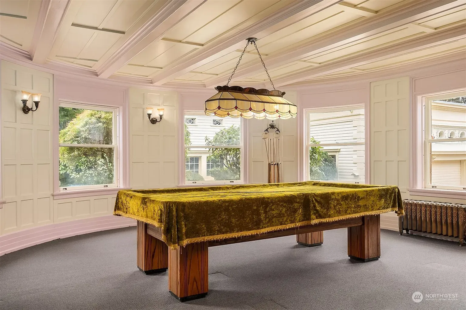 Pool table room! Lime felt, creamy coffered ceiling, everyone’s suddenly competitive.