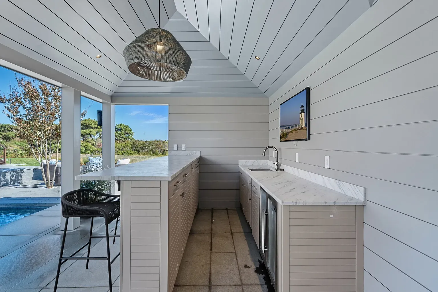 Another kitchen, bright shiplap ceiling, airy and clean. Plants would love this.