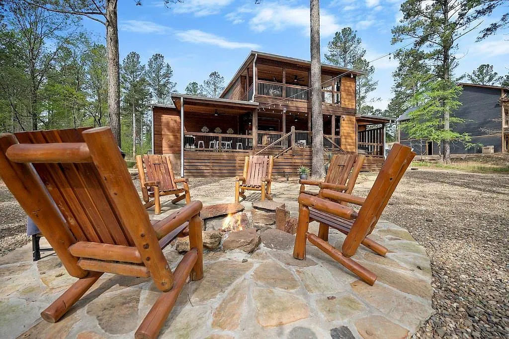 Rocking chairs around a stone fire pit. Fall nights basically planned.