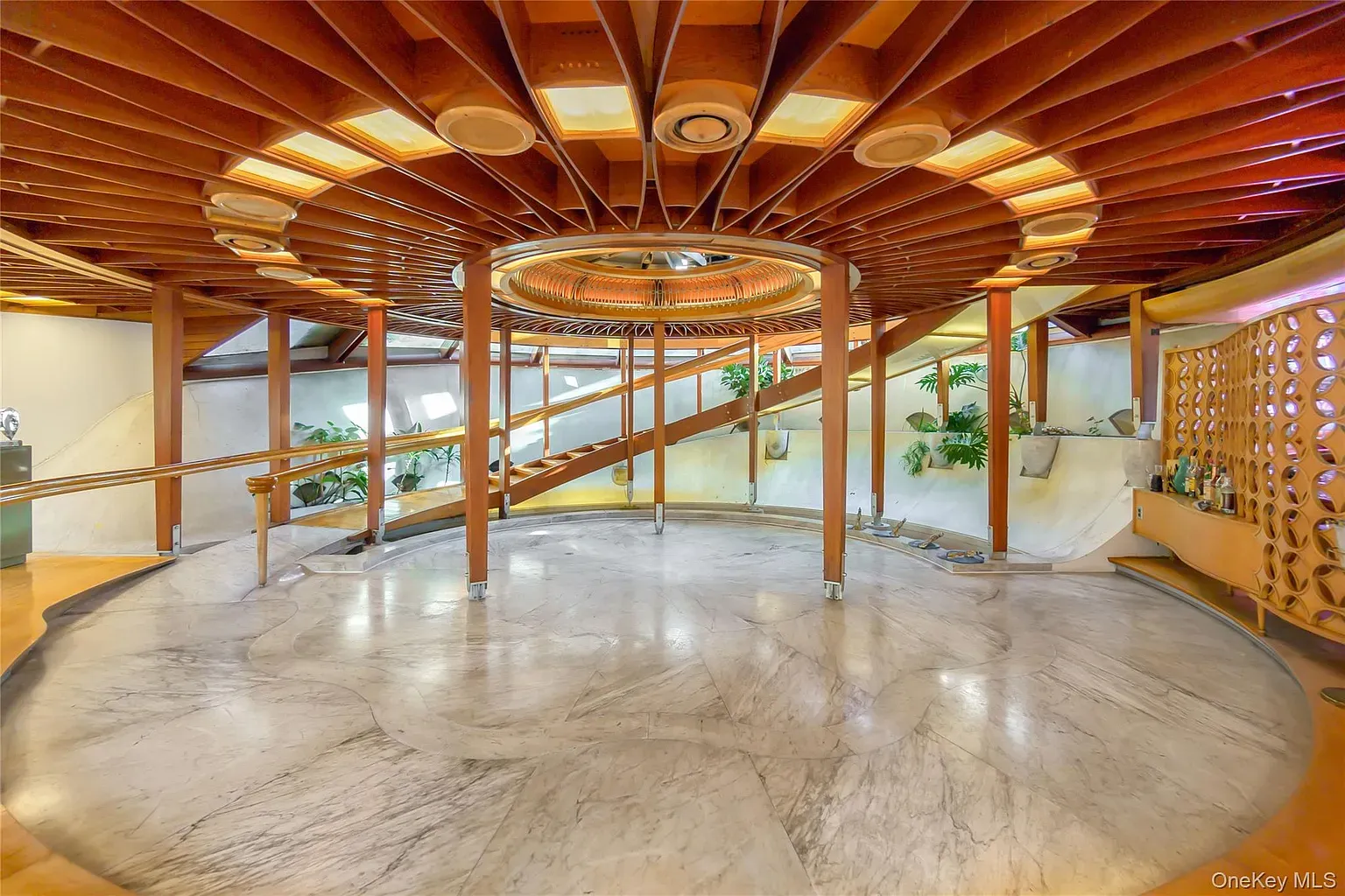 Entry with the circle theme again. Slatted ceiling and skylights absolutely slap.