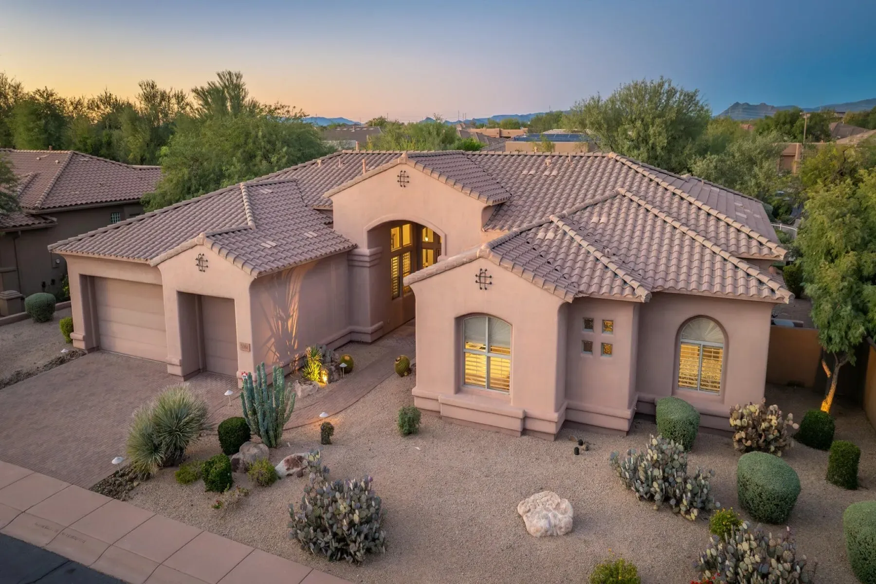 Beige stucco and terracotta roof—totally classic Southwest curb appeal.