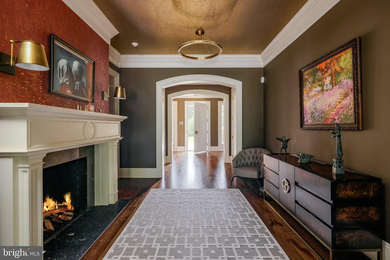 Foyer goes dark brown and luxe. Warm, moody, pretty inviting.